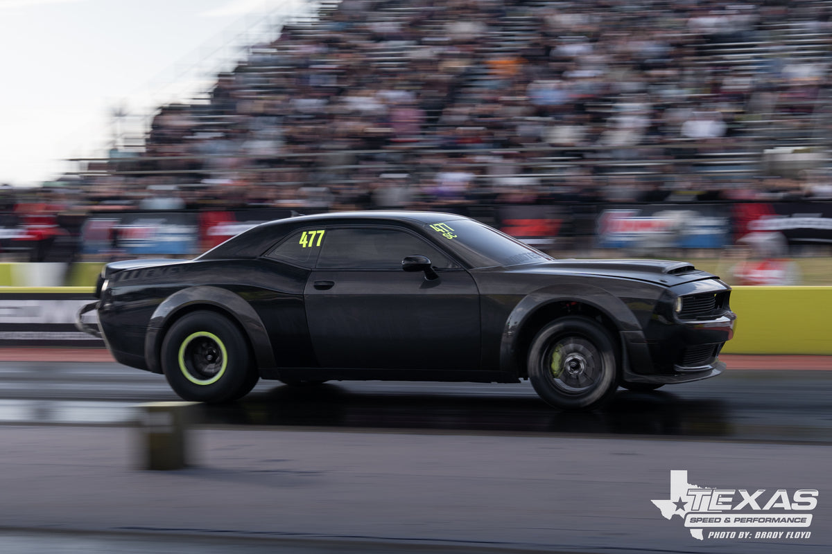Luckey Racing black Challenger racing on track. Photo by Brady Floyd, Texas Speed and Performance.